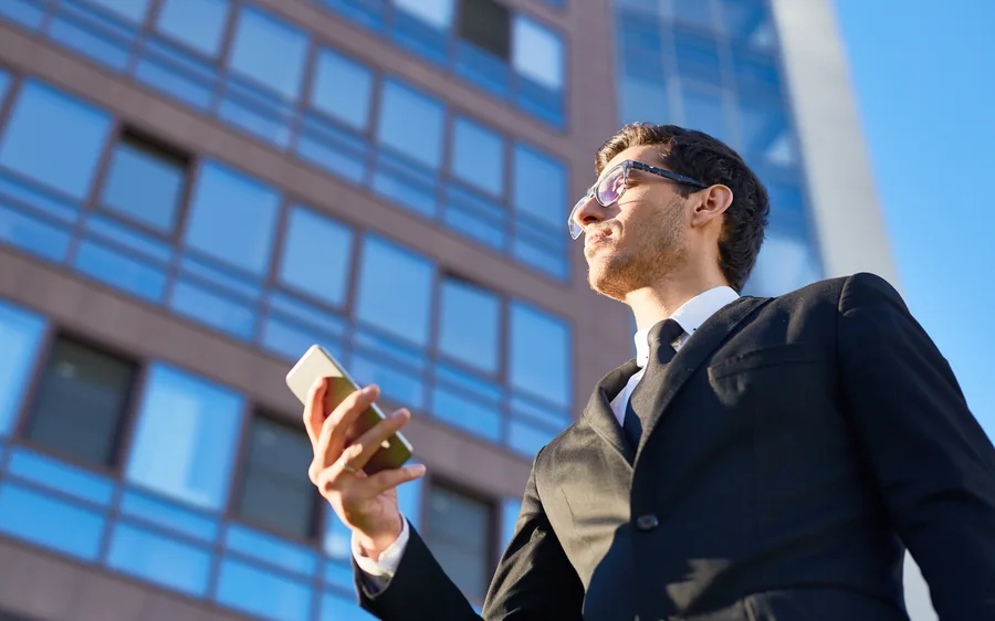 An investor before an office tower — residency by investment
