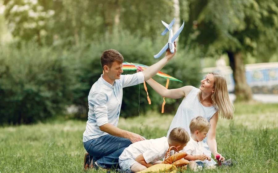 A family playing outdoors — second citizenship for the whole household